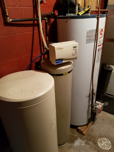 Lower level utility water heater